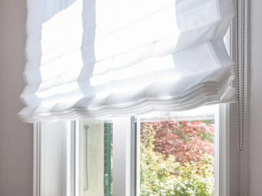 Silent Gliss blinds installer fitting motorised blinds in a luxury home